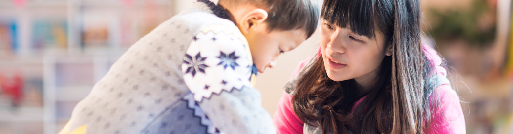 person helping out child
