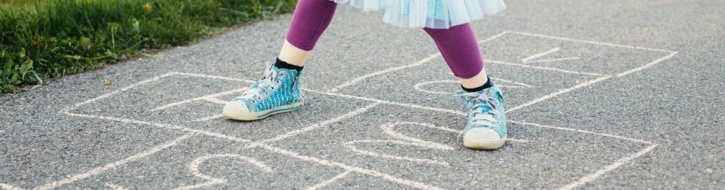 child playing hopscotch