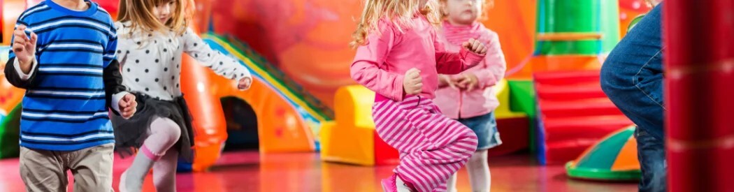 children dancing in soft play area