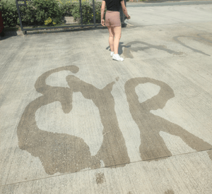 outdoor writing with water activity for early years mark making