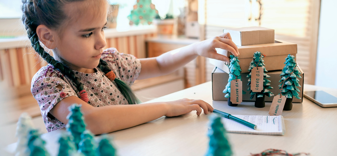 child painting crafted trees