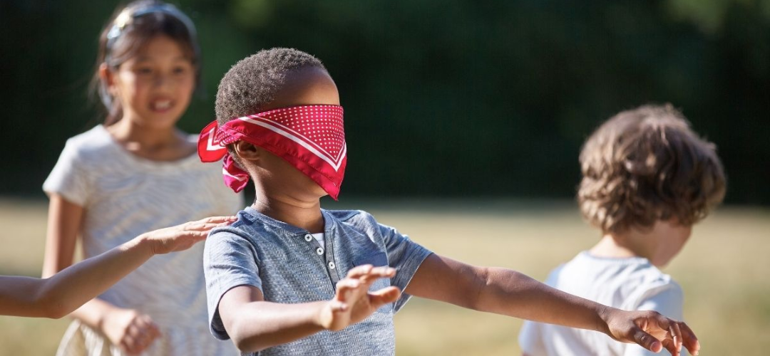 child playing blindfold activity