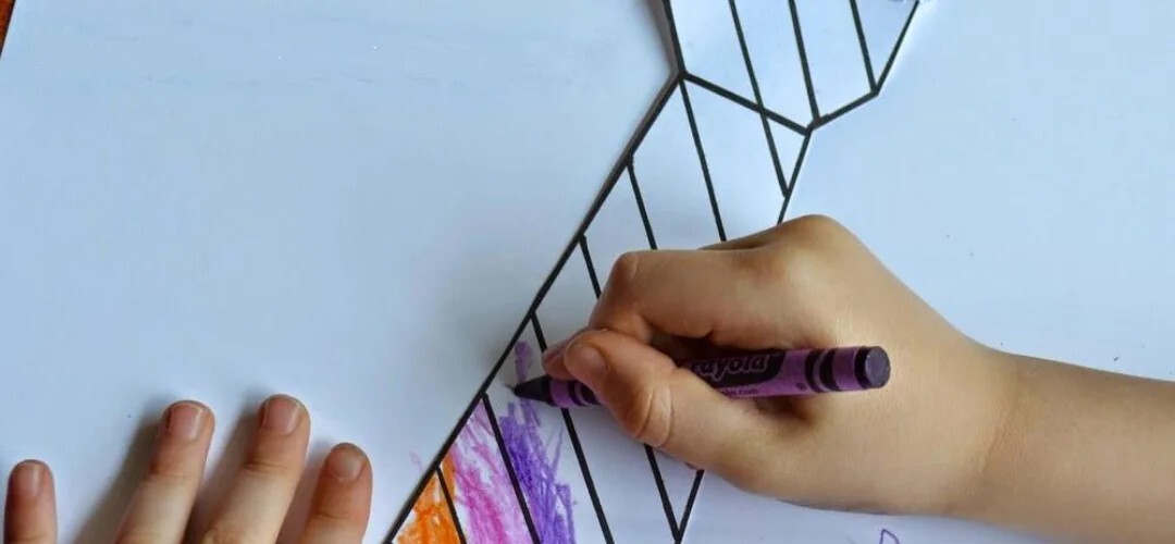 child colouring in their tie template for a father's day craft