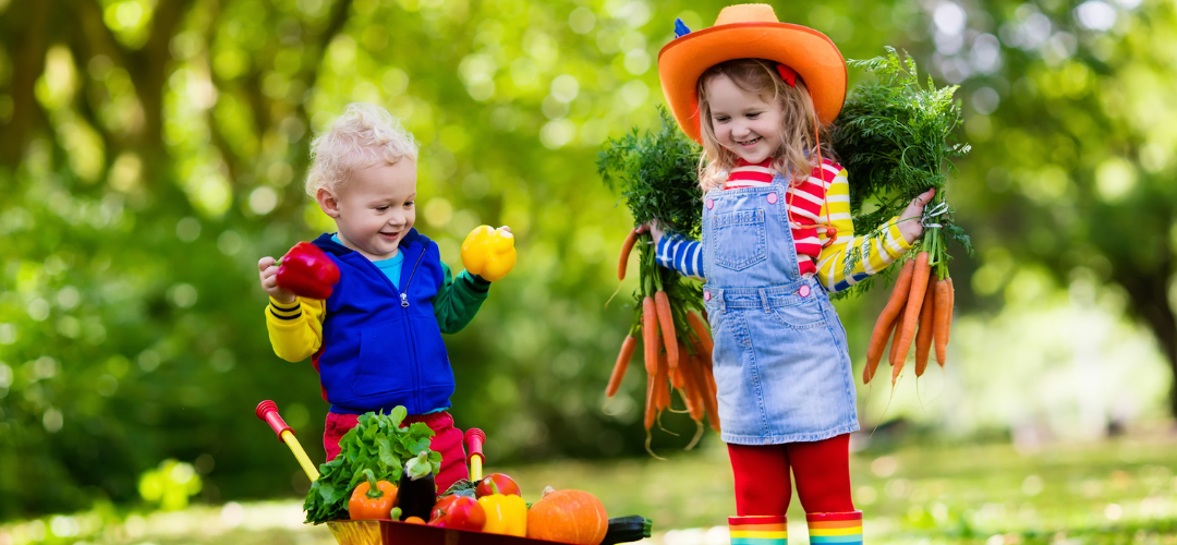 children holding vegetables