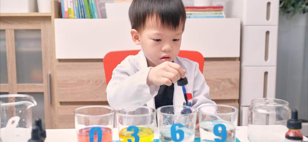 child pipetting food dye