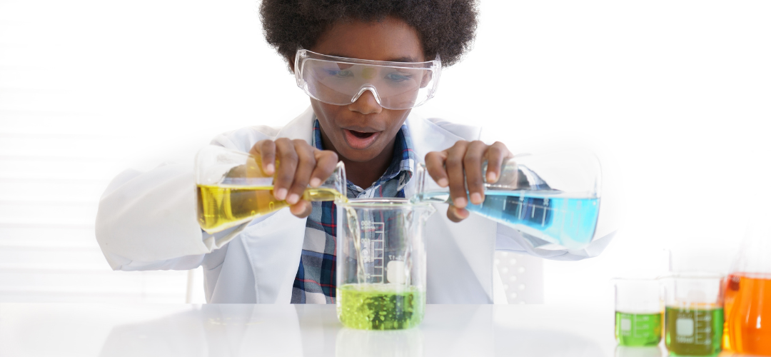 child mixing solutions into beaker 