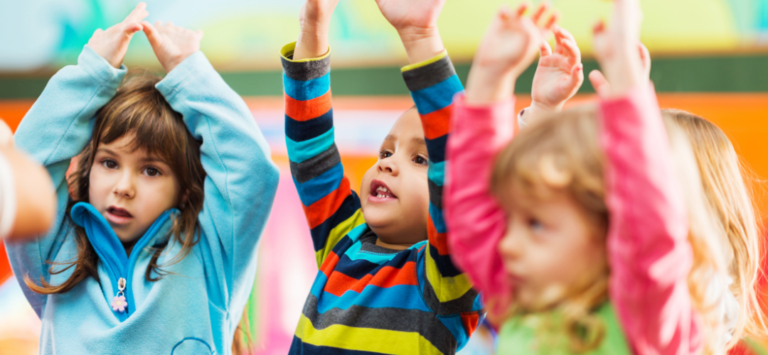 children with their hands in the air
