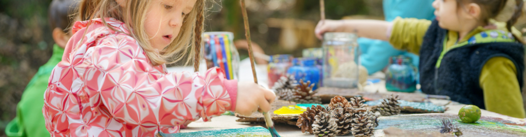 children painting natural resources