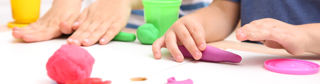 children playing with modelling materials