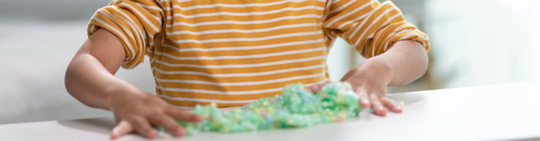 child playing with slime