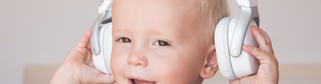 young child wearing headphones