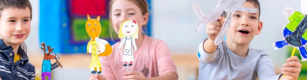 children with hand made puppets