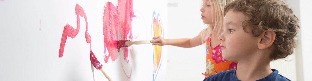 children painting on white wall