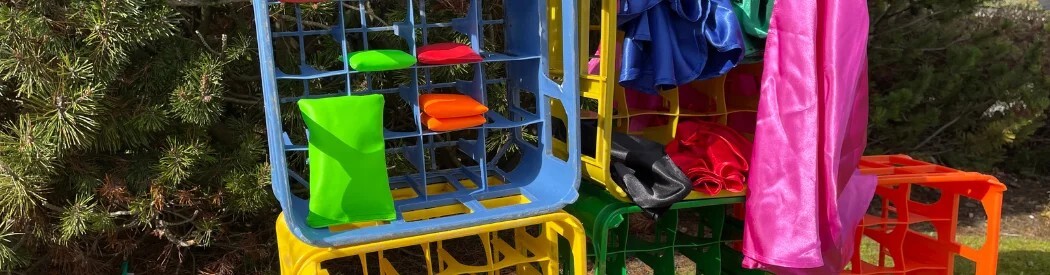 crates stacked on top of each other with physical activity resources stored inside