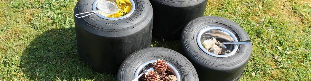 small tyres holding bowls and natural resources