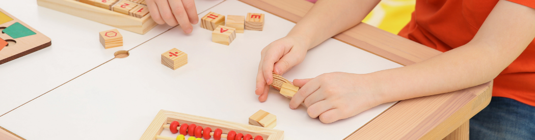 Children playing with Maths Cubes