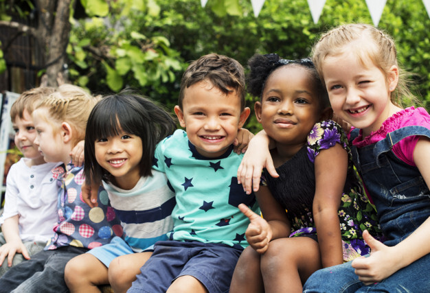 diverse range of children sitting together
