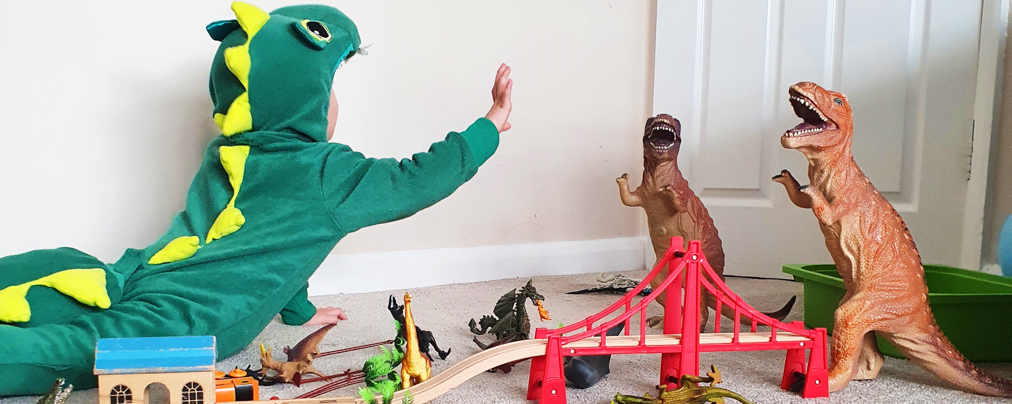 child engaging in dinosaur role play
