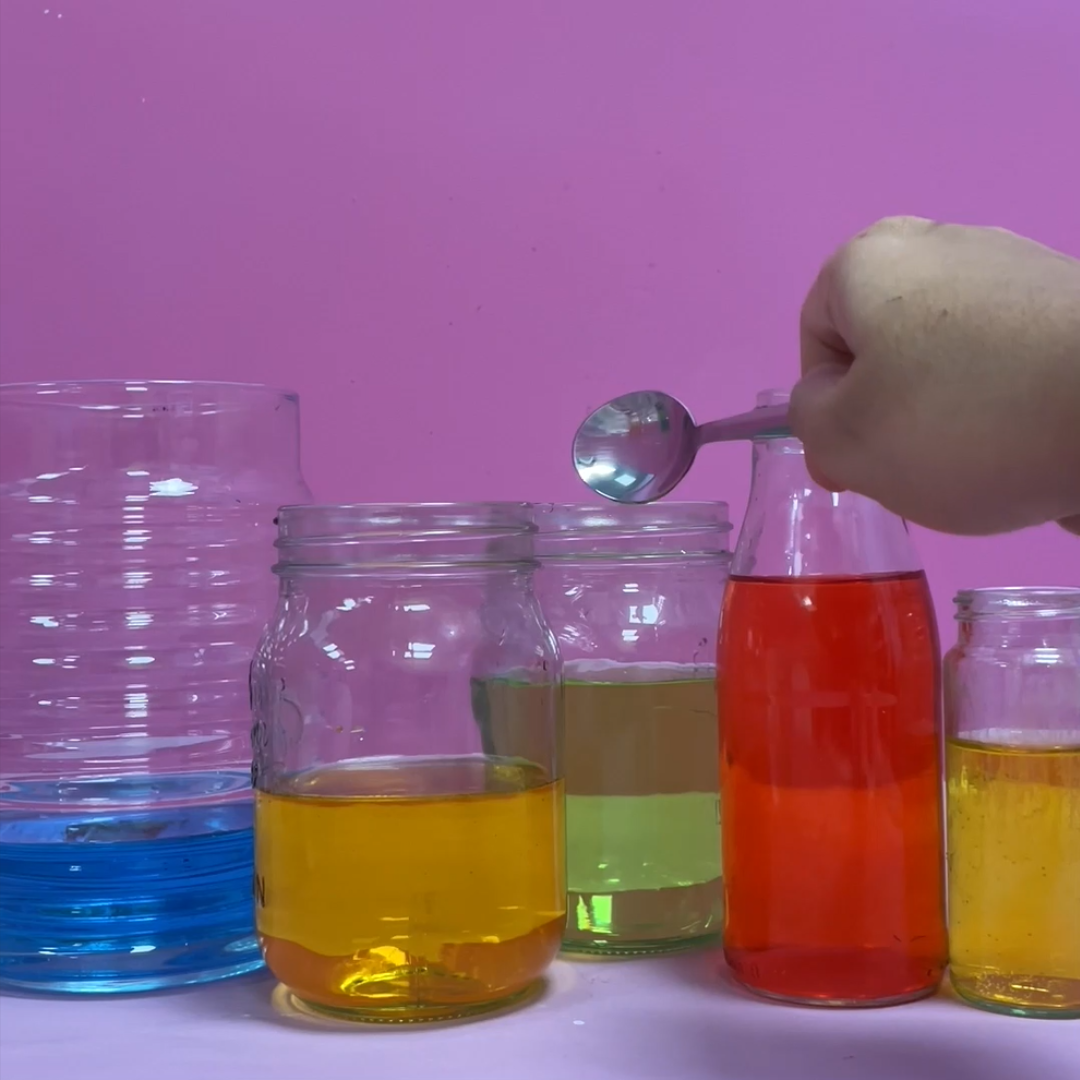 jars filled with different coloured water