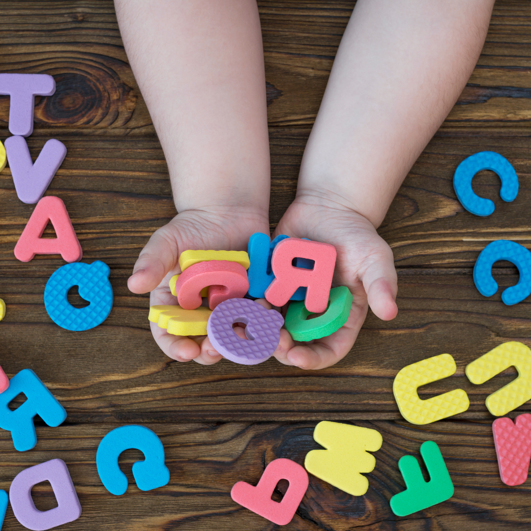 children holding letters of the alphabet