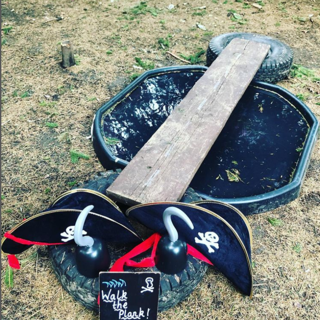tuff tray filled with water has a plank going over the top 