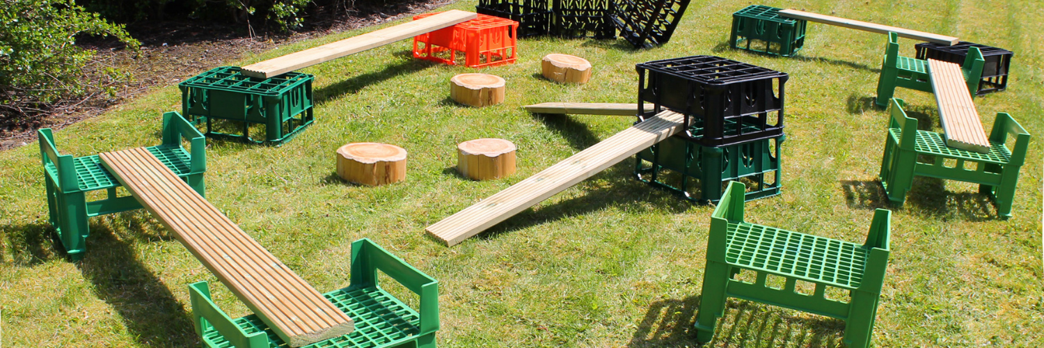 Obstacle course made from crates, planks and logs 